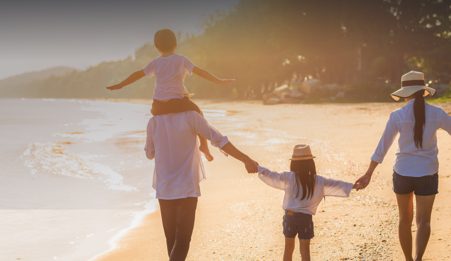 Image of family standing on beach looking forward to working with Moskowitz LLP